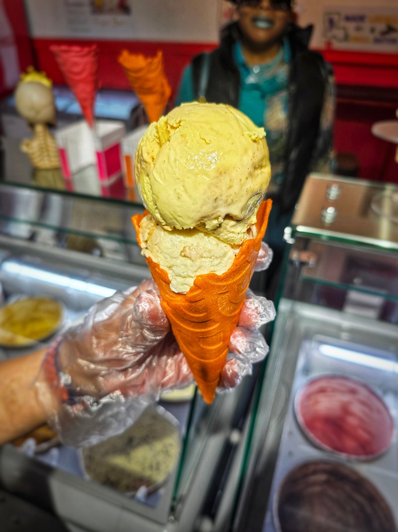 Pumpkin ice cream in a waffle cone